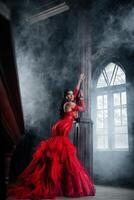 Woman Vintage Red Dress Old Castle Beautiful Princess In Seductive Dress photo