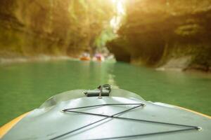 Kayaking on the river. group of people in a boat sailing along the river. Rowers with oars in a canoe. Rafting on a kayak. Leisure. photo