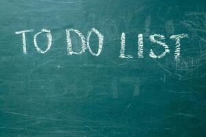 To do list it handwritten with white chalk on a green blackboard photo