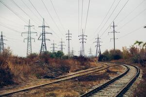 Industrial foggy landscape - old abandoned industrial zone in autumn forest photo