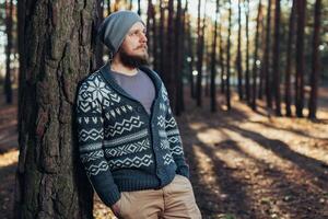 Outdoor portrait of handsome bearded man . Casual autumn fashion portrait photo