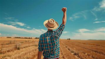 AI generated Back view of a male farmer raising his hand to the sky with clear sky background photo