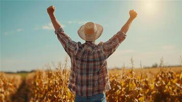 AI generated Back view of a male farmer raising his hand to the sky with clear sky background photo