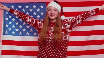 Christmas adult girl waving and wrapping in American flag, celebrating, human rights and freedoms video