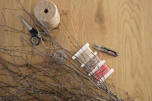 Supplies for making DIY wicker wreath of birch branches, copy space photo
