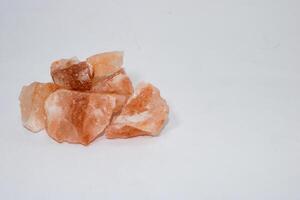 Himalayan pink salt rocks with copy space. photo