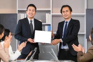 Employee gets a certificate of achievement, Businesspeople with certificate in the office, Businessman giving appreciation certificate to employee for achievement photo