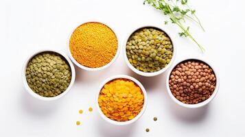 AI generated Assorted legumes and grains in bowls on white background. Top view. Concept of vegetarian protein sources, healthy eating, and dietary diversity photo