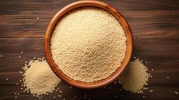 AI generated Bowl of uncooked quinoa on a wooden table. Concept of healthy eating, whole grains, and nutritious food options. Top view. photo