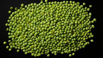 AI generated Top view of green split peas isolated on black backdrop. Concept of vegan nutrition, cooking basics, and organic produce. Top view. Textured background photo