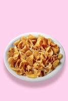 corn flakes with milk on plate on colorful background photo