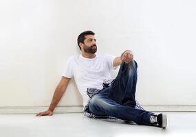 young man with a beard in several different situations photo