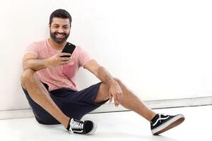 young man with a beard in several different situations photo