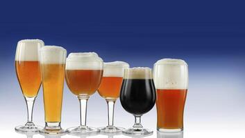 several beers being served in specific glasses photo