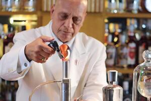 professional bartender showing all his talent and experience photo