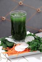 Healthy and detoxifying fruit and vegetable juices photo