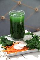 Healthy and detoxifying fruit and vegetable juices photo