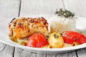 grilled cod with rice and confit tomatoes photo