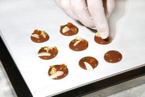 step by step production of chocolate candies photo