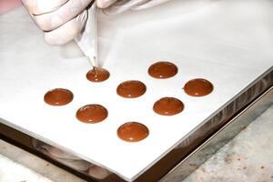 step by step production of chocolate candies photo