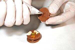 step by step production of chocolate candies photo