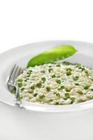 step by step of pea risotto with cheese. Classic Italian dish photo