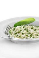 step by step of pea risotto with cheese. Classic Italian dish photo