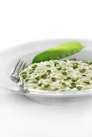 step by step of pea risotto with cheese. Classic Italian dish photo