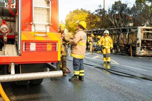 Rescue Team of Firefighters Arrive on the Car Crash photo