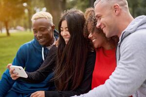 Multi ethnic friends outdoor. Diverse group people Afro american asian caucasian spending time together photo