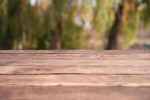 Empty wooden table nature bokeh background with a country outdoor theme,Template mock up for display of product photo