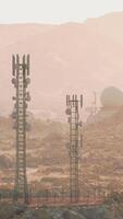 A group of satellite dishes on a desert landscape, capturing signals from space video