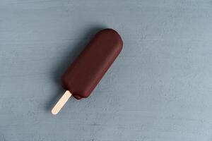 ice cream stick  on dark  background  covered chocolate sticks frozen Popsicle and Lolly sweet dessert  Flat lay photo