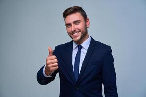 Close up portrait young man businessman. Caucasian guy business suit studio gray background. photo