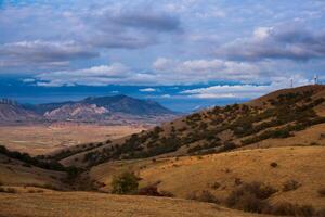 windmills on the mountain near the sea harbor photo