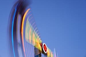 Amusement park blurred effect. Abstract illuminated background photo