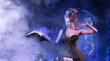 Christmas fairy tale concept. Snow queen calling winter use book of spells photo