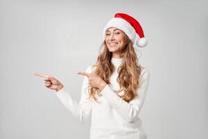 Woman christmas Santa Hat sweater white studio background photo