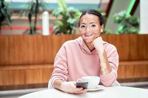 Black african american woman with vitiligo pigmentation skin problem indoor dressed pink hoodie photo