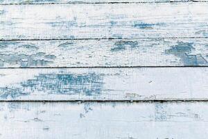 closed up of old wood background. Vintage wood background with blue color peeling paint. photo