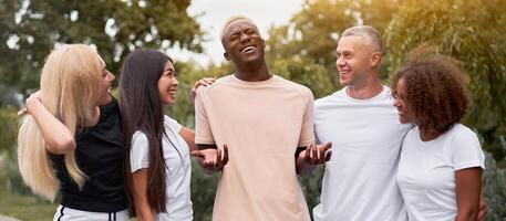 Multi-ethnic group people teenage friends. African-american, asian, caucasian student spending time together Multiracial friendship photo