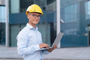 Business, Architect Using Laptop Outdoors Office Building Background photo