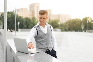 Business. Businessman Using Laptop Outdoors. Modern Technology Concept photo