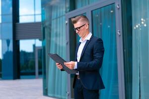 Business. Businessman Glasses Standing City Street Near Office Building photo