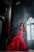 Woman Vintage Red Dress Old Castle Beautiful Princess In Seductive Dress photo