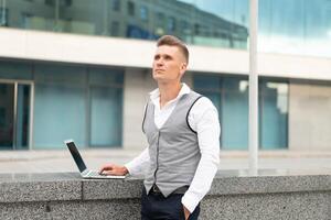 Business. Businessman Using Laptop Outdoors. Modern Technology Concept photo