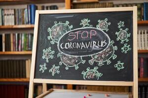 Quarantine. Outbreak Warning. written white chalk on blackboard in connection with epidemic of coronavirus worldwide. photo