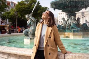 Female tourist enjoying in Lisbon downtown photo