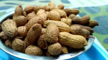 Peanuts in a shell. Organic raw groundnut photo
