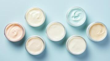 AI generated Variety of organic cosmetic creams for skin care in open jars on a blue background. Top view. Concept of skincare variety, cosmetics assortment, and beauty product display photo